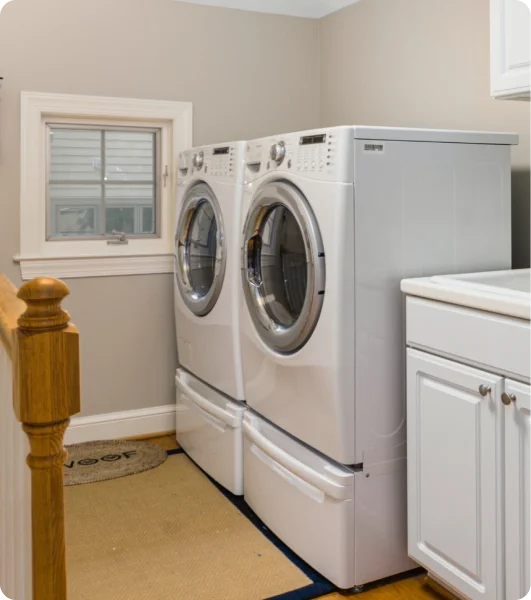 A laundry room with a dryer.